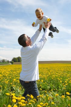 Proud Father - Holding Up Child -
