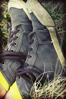 Retro styled sneakers in grass