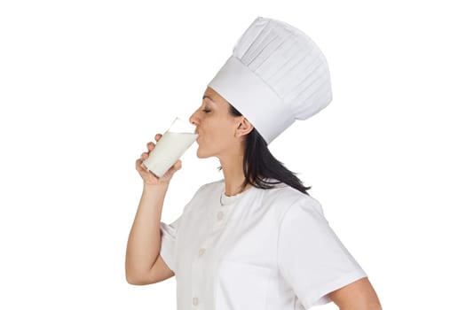 Pretty cook girl with a glass of milk