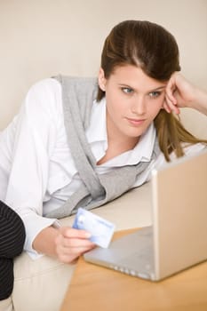 Home shopping - woman with credit card and laptop