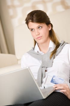 Home shopping - woman with credit card and laptop