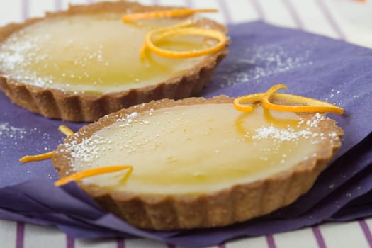 Two orange tartlets
