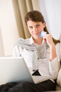 Home shopping - woman with credit card and laptop