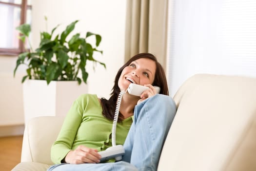 On the phone home Happy woman calling