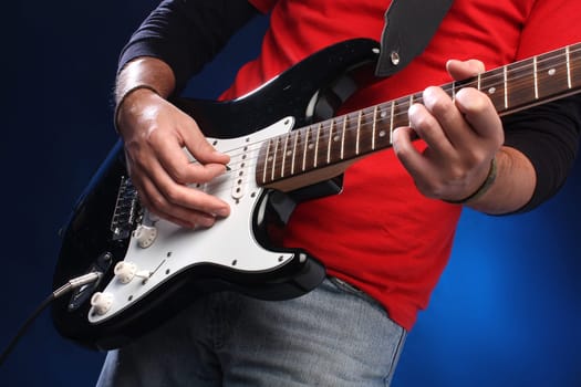Playing electric guitar