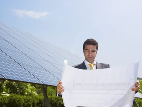 businessman and solar panels