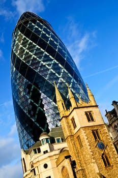 Gherkin building and church of St. Andrew Undershaft in London