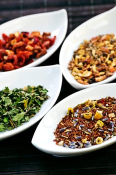 Assorted herbal wellness dry tea in bowls