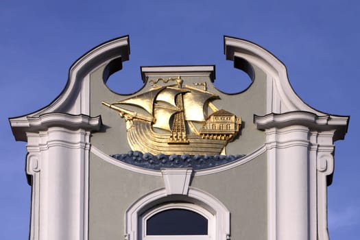 Golden cog on the gable
