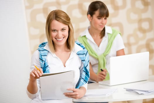 Student at home - two happy woman with laptop