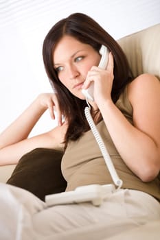On the phone home - young woman calling
