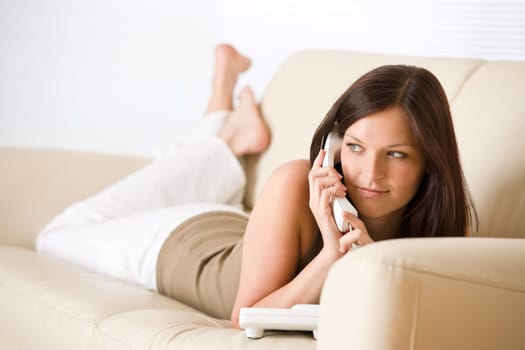 On the phone home - young woman calling