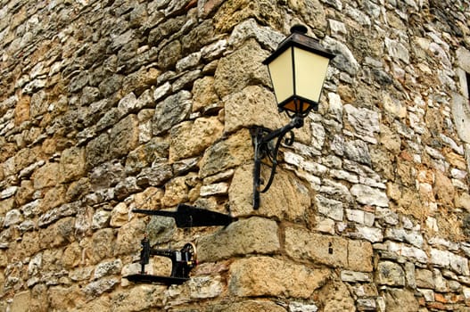 Masonry with lantern and sewing machine at the Maison de la Scipione,La Couvertoirade