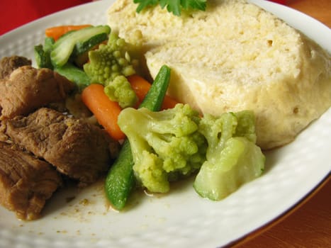 Bohemian dumplings with goulash and vegetables