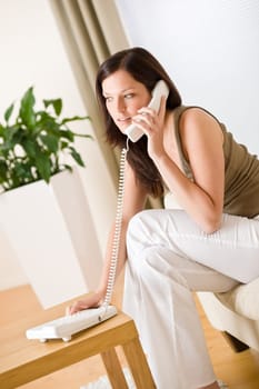 On the phone home - young woman calling