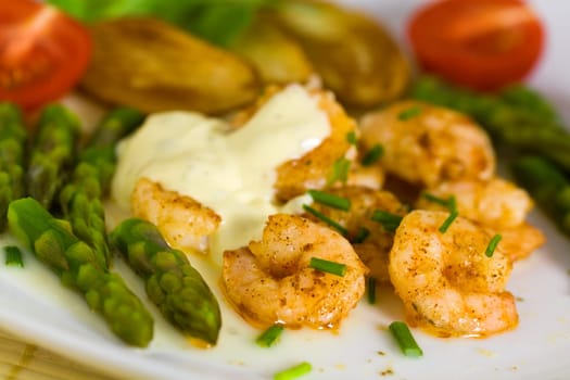 Prawns with baked potatoes,and green
