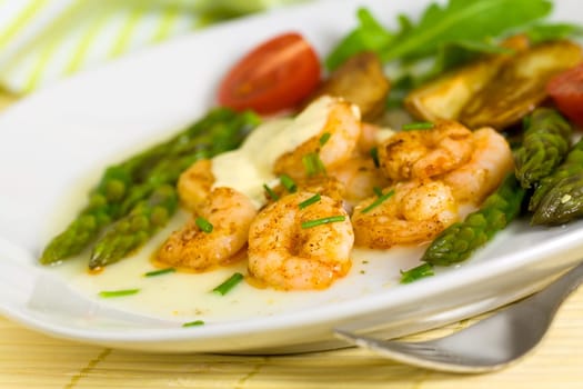 Prawns with baked potatoes,and green