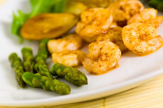Prawns with baked potatoes,and green