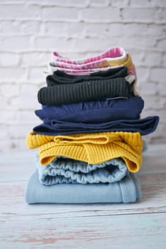 Stack of clothes on table indoor