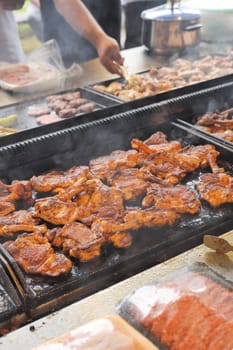 Beef steaks on the grill with flames