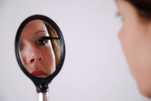 Apply mascara