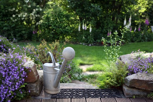 Zinc watering can in the garden