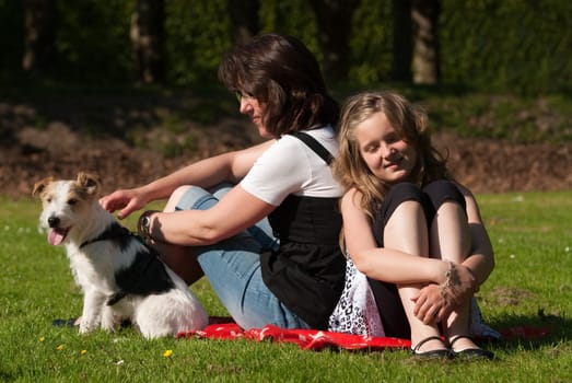 Woman with daughter and dog