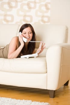 On the phone home - young woman calling