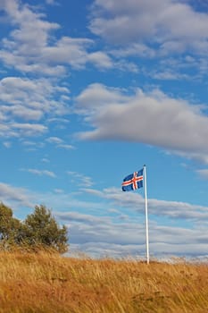 Beautiful clouds over the icelandic flag, Iceland