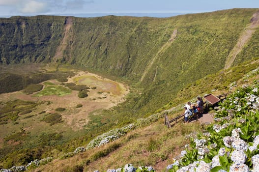Tourists admiring Caldeira volcano in Faial, Azores