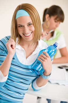 Student at home - two young woman study together