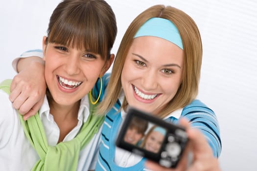 Student at home - two young woman study together
