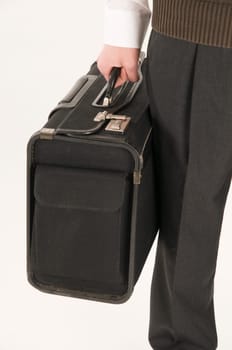 suitcase in firm grip