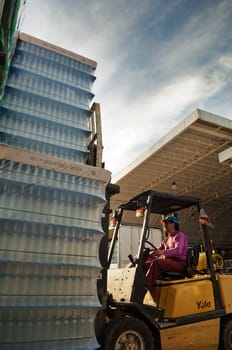Piling bottles with a forklift
