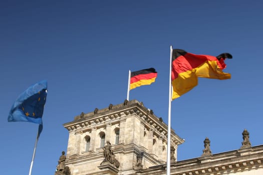 Reichstag in Berlin with German flags