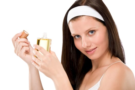 Beautiful woman holding perfume