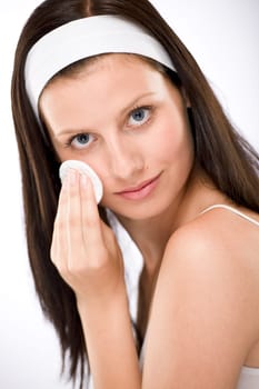 Facial care - woman removing make-up