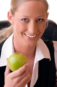 Young woman holding apple in hand