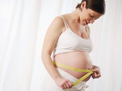 pregnant woman drinking water