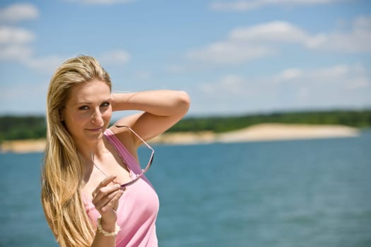 Blond woman enjoy summer sun