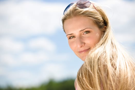 Blond woman enjoy summer sun