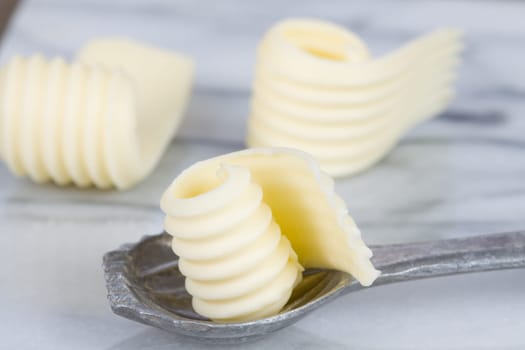 Butter flakes on spoon