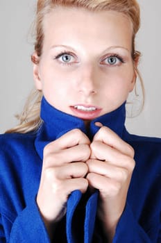 Pretty lady in blue coat.