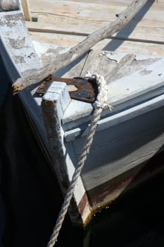 A wooden rowing boat tide down
