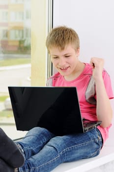 teenager with laptop