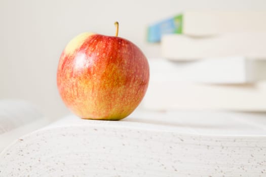 Books and apple