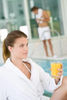 Luxury spa young woman in bathrobe relax