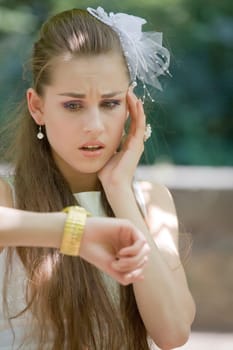 worried bride looking at watch