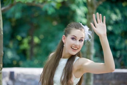 young bride waving with hand