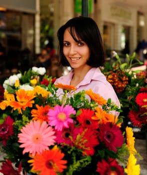 Woman with many flowers